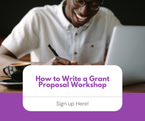 Man happily writing grant proposal